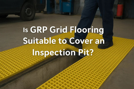 A mechanic walking across a GRP grid floor covering an inspection pit in a vehicle workshop, showing safe, non-slip, heavy-duty flooring designed for industrial environments.
