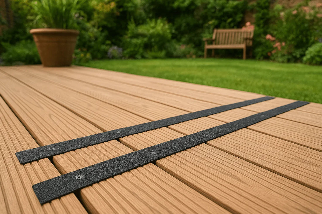 Close-up view of wooden decking with black anti slip strips installed in a UK garden.