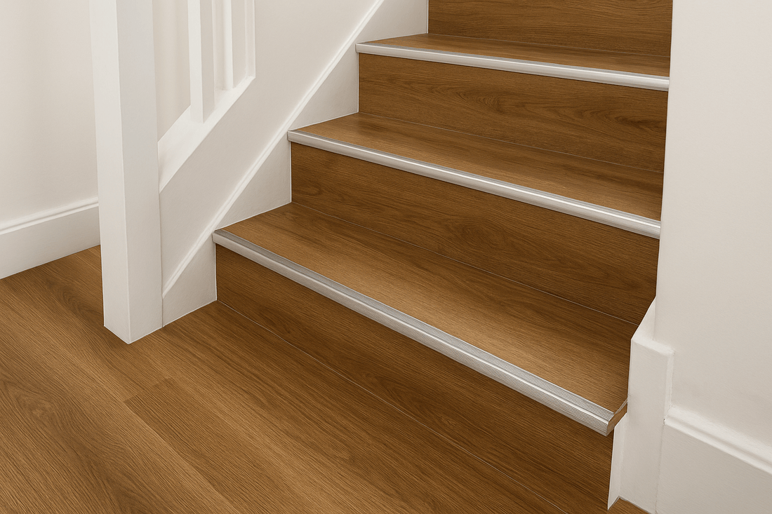 Modern UK staircase with luxury vinyl tile (LVT) flooring and aluminium stair nosing trim for safe and stylish edge protection.