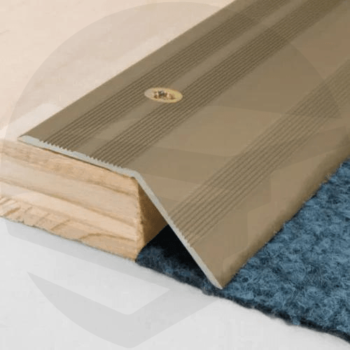 Close-up of an aluminium door threshold ramp profile, showcasing its anodised finish and textured surface for slip resistance 900x37mm brown- finishings UK