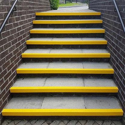 Close-up of Weatherproof Bolt-Down Step Anti-Slip Aluminium Treads.Yellow non-slip stair edging GRP heavy-duty