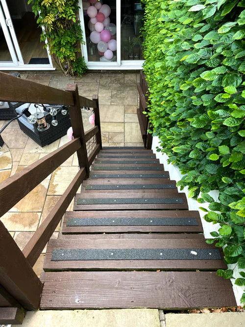 Installation of non-slip strips on wooden stairs using screws..Non-Slip Standard GRP Decking Strips on wooden stairs- finishings UK